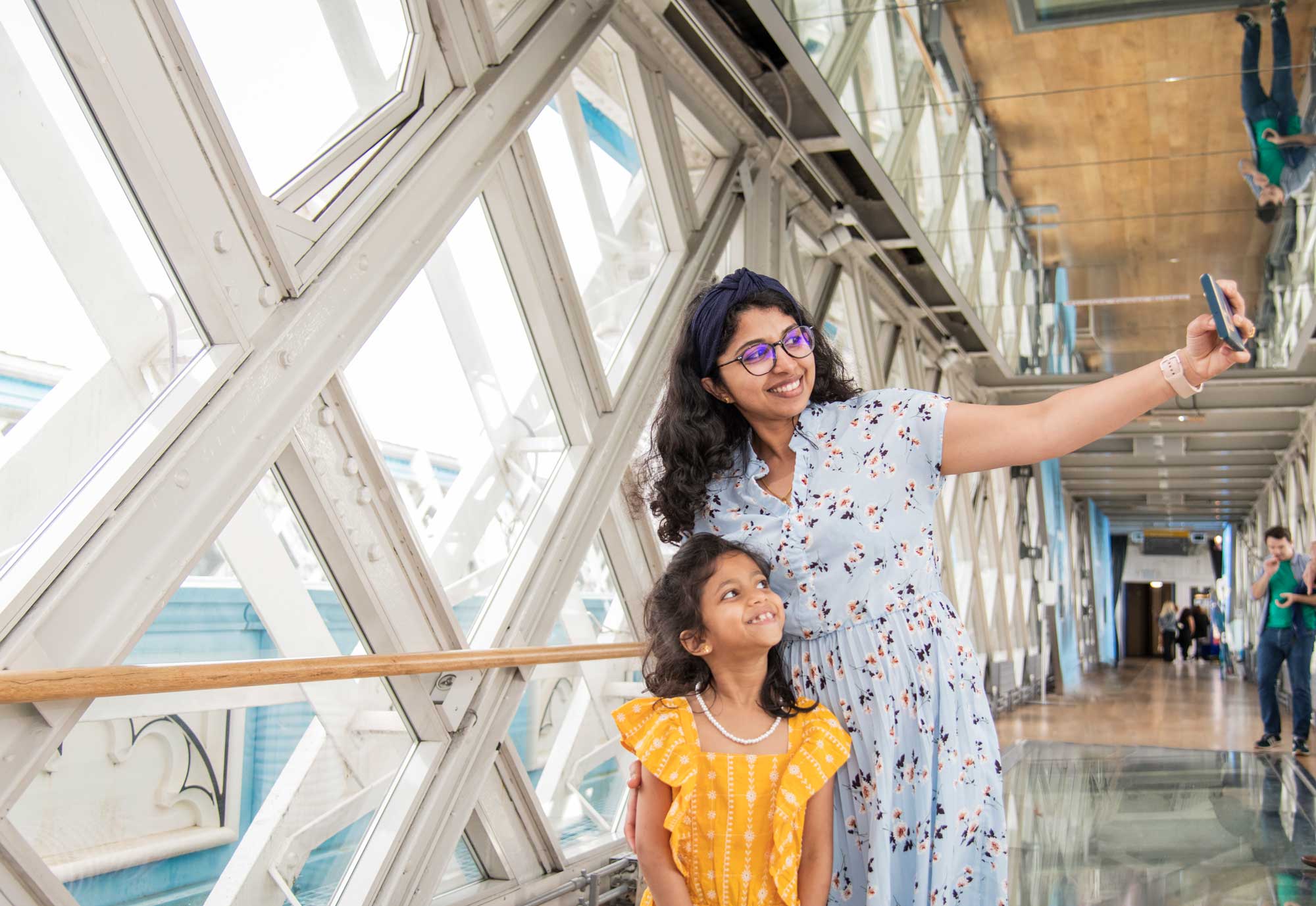 A woman and daughter enjoy a photo on the Walkways