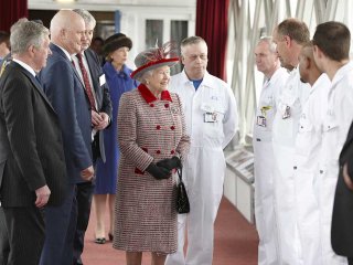 Queen Elizabeth II meets staff inside Tower Bridge. Copyright Clive Totman