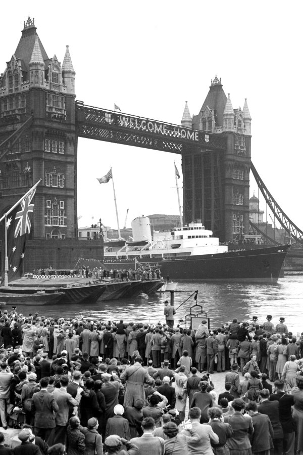 Royal Yacht Brittania sailing through Tower Bridge. Credit: Topfoto