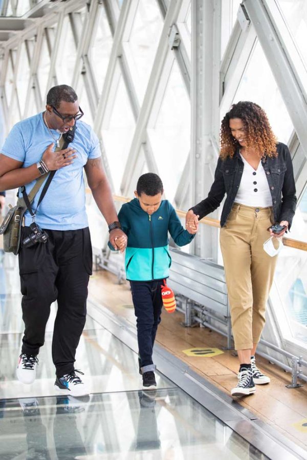 Family walking on glass floor
