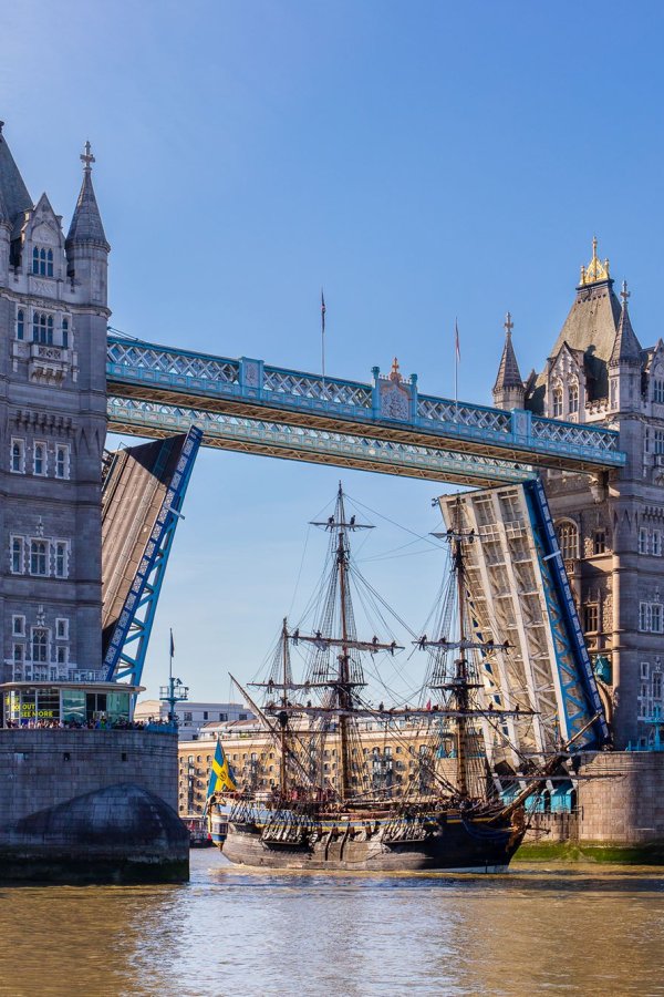 The Götheborg of Sweden sails through Tower Bridge on a sunny day