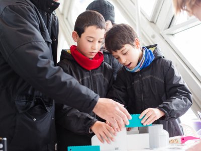 Families building Tower Bridge model
