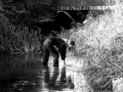 Imogen Piper collecting water from the source of the Thames