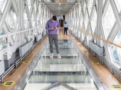 Man looking through Glass Floor