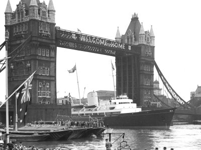 Royal Yacht Brittania sailing through Tower Bridge. Credit: Topfoto