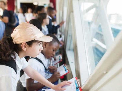 Children on school trip inside Tower Bridge