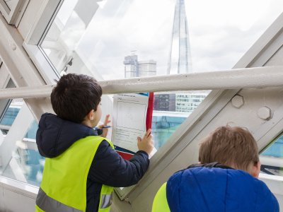 Tower Bridge Learning - completing worksheets looking out at the London Skyline
