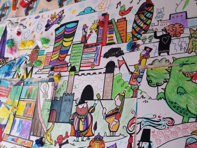 A collage of brightly coloured drawings by children