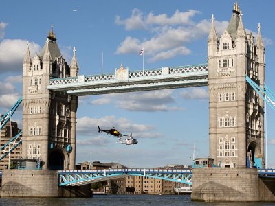 Two helicopters fly through Tower Bridge in 2012