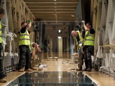 Men in high-vis jackets replace the Glass Floor 