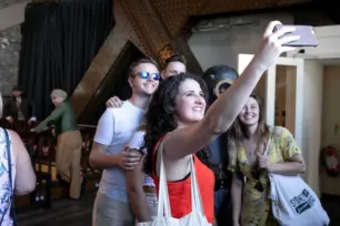 A group pose for a 'selfie' inside Tower Bridge with a Victorian diver