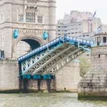 A close up image of Tower Bridge showing the bascules raising