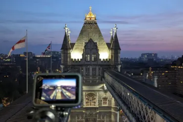A camera filming sunset on top of the Walkways on level 5 of Tower Bridge