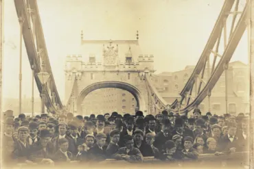 Historic photo of crowd of men and boys on Tower Bridge