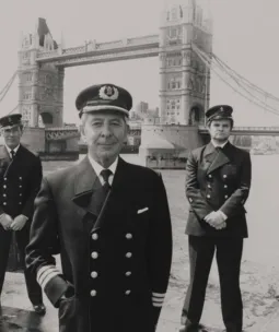 5 men standing in front of Tower Bridge