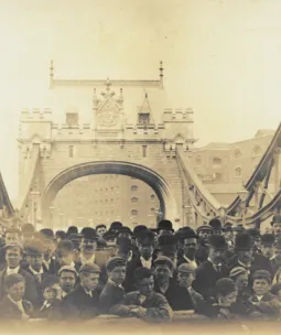 Historic photo of crowd of men and boys on Tower Bridge