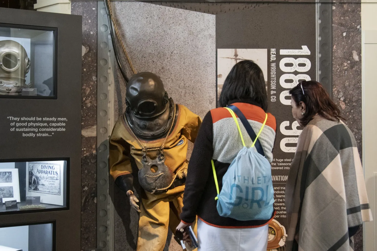 Two guests interacting with the Diver costume at the North Tower at Tower Bridge.