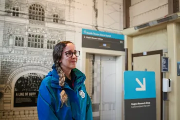 A Welcome Host, dressed in blue uniform at Tower Bridge