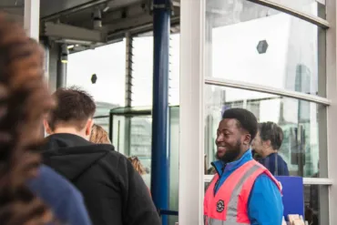 A Welcome Host greeting visitors at the Ticket Office at Tower Bridge