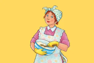 A woman in a patterned apron and headscarf, stirring a bowl of cake mix