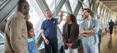 A group of visitors on a guided tour at Tower Bridge.