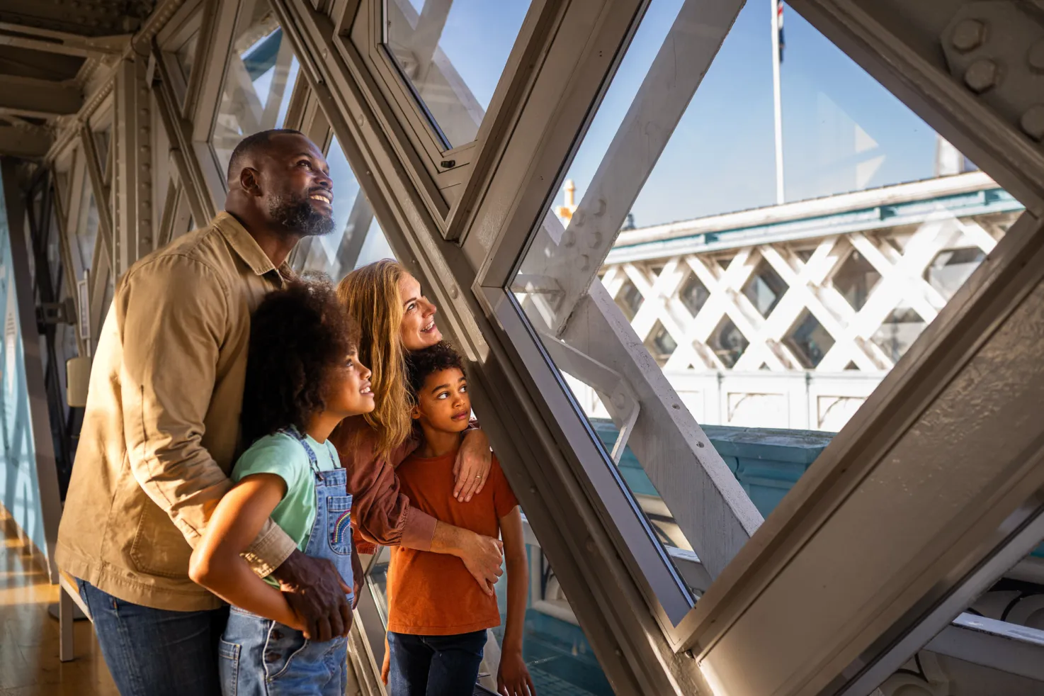 A family admiring the views from the Walkways at Tower Bridge