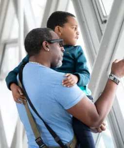 A family looking at the views on the Walkways at Tower Bridge.