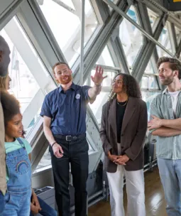 A group of visitors on a guided tour at Tower Bridge.